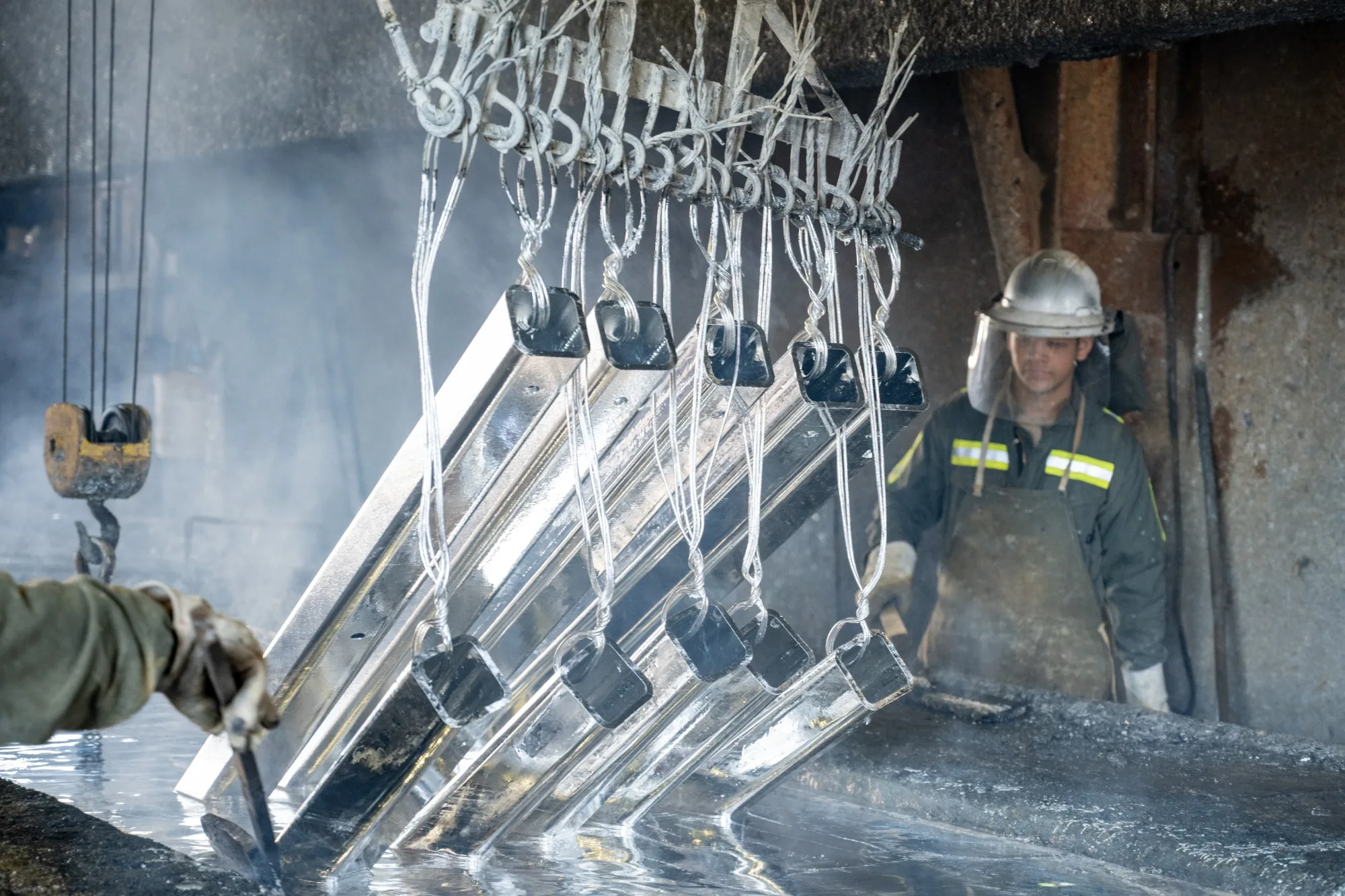 steel being galvanized through hot dip galvanizing process