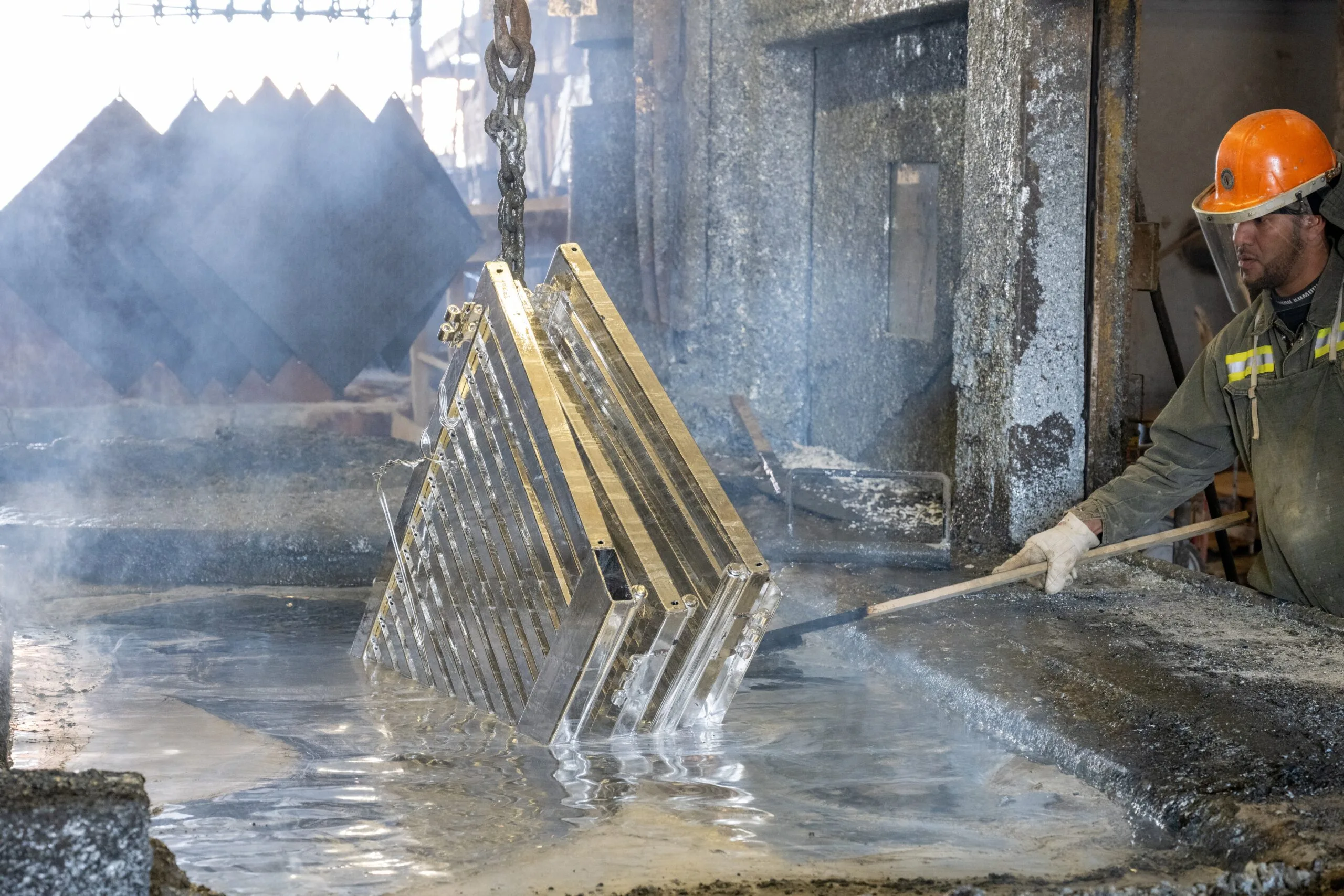 railings being hot dip galvanized in galvanizing kettle